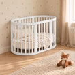 BusyKids MIRACLE 7-in-1 mitwachsendes Babybett mit Matratze